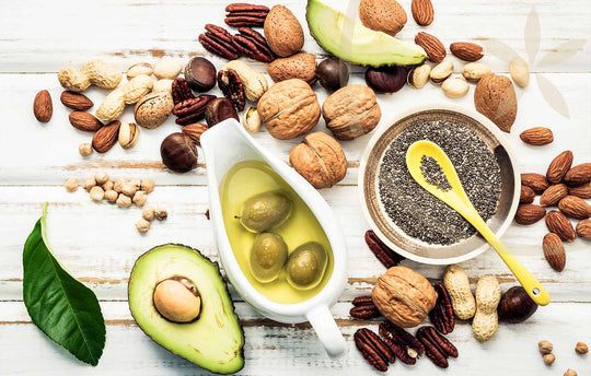 Healthy whole food fats including avocado, nuts, chia seeds & extra virgin olive oil