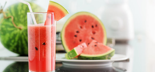 Slices of watermelon and watermelon juice in a glass