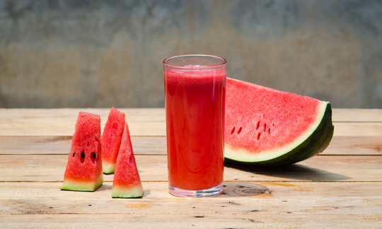 Slices of watermelon and watermelon juice in a glass